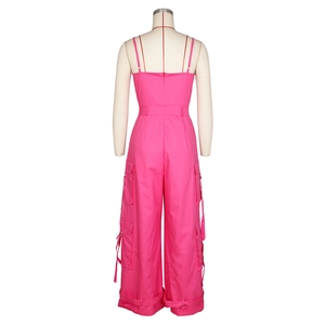 Back view of fuchsia tube top utility jumpsuit featuring cargo pockets and wide legs