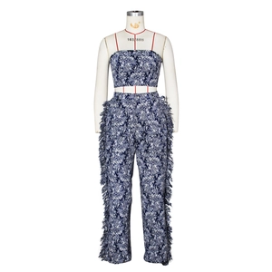 Detail of blue floral print two-piece set featuring tassel fringe on trousers