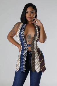 Detailed close-up of a patchwork halter top made from colorful striped and polka dot ties