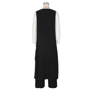 Rear view of black sleeveless long tunic and wide-leg pants set with white piping trim