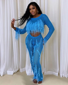 Detailed view of blue knit crochet set featuring fringe feathers and mesh textures