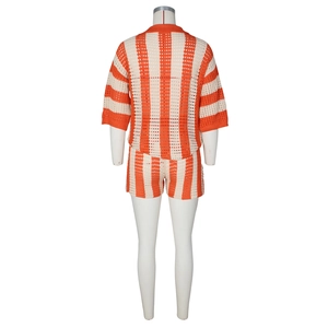 Detail view of orange and cream striped crochet knit shorts set from back view
