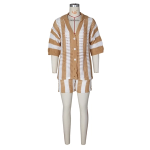 Detail of khaki striped knit set showing hollow crochet texture and white buttons