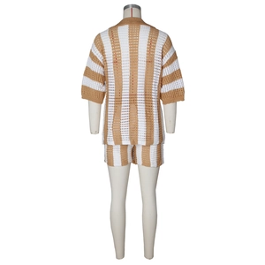 Detail of crochet knit two-piece set featuring vertical beige stripes and hollow textures
