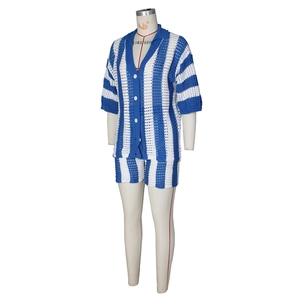 Detail of blue and white vertical stripe knit pattern with hollow crochet texture