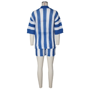 Detail of blue and white striped knit shorts and crochet texture on a mannequin