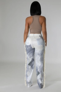Detailed back view of marble print high-waisted wide leg trousers with white side fringe