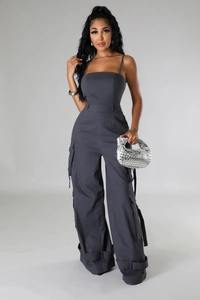Detail of dark grey strapless utility jumpsuit with multiple cargo pockets and waist belt