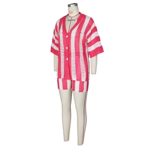 Detailed view of pink and white vertical stripe crochet knit pattern on two-piece short set