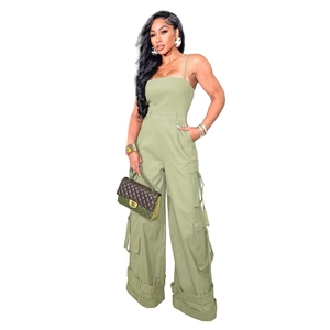 Detail of sage green utility jumpsuit featuring cargo pockets and wide leg cut