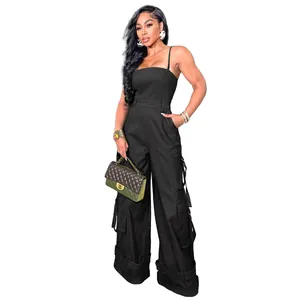 Detail of black strapless cargo jumpsuit with functional side pockets and ankle straps