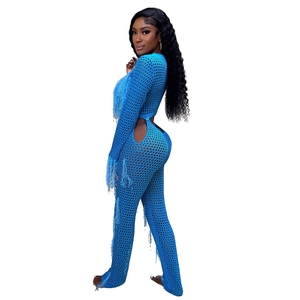 Close-up of blue crochet two-piece set featuring hollow mesh knit and long fringe details