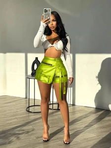 Women's bright lime green high-waist satin cargo shorts with pockets and utility straps