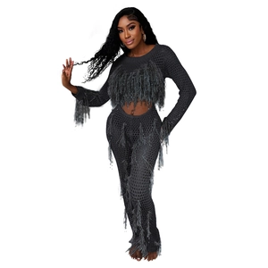 Close-up of gray crochet knit two-piece set featuring mesh hollow out and tassel fringe