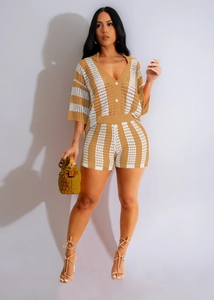 Detail of women's crochet knit two-piece set featuring hollow stripes and V-neck cardigan