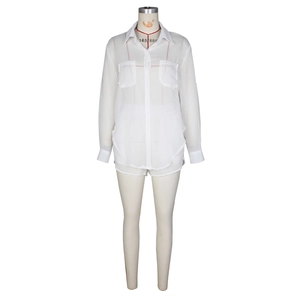Detail view of white sheer long-sleeve shirt with chest pockets and matching shorts