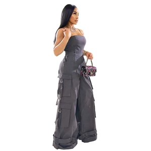 Detail of charcoal grey strapless cargo jumpsuit with wide legs and utility pockets