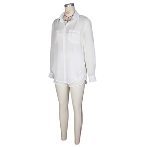 Detail of white sheer chiffon shirt featuring double chest pockets and lapel collar