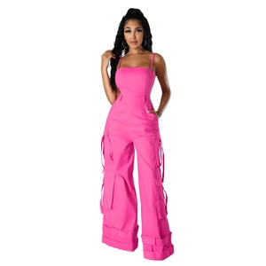 Detail of rose pink strapless cargo jumpsuit with utility pockets and wide leg cut