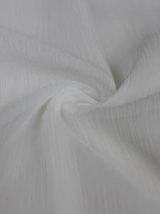 Detail shot of white semi-transparent chiffon fabric with vertical crinkle texture