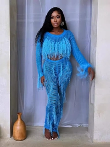Two-piece blue crochet set with long sleeves and hollow knit fringe details on model