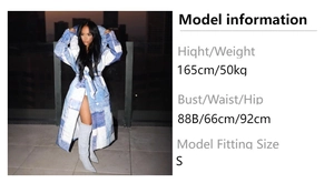 Detail view of denim patchwork long coat with large hood and waist belt for women