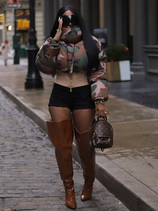 Women's vintage camouflage cropped puffer jacket and brown over-the-knee boots outfit