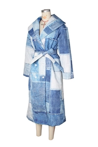Detail of denim patchwork print long coat with wide lapels and double-breasted buttons