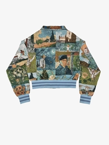 Close-up of vintage tapestry texture and Van Gogh painting patterns on bomber jacket