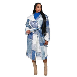 Detail of long quilted winter coat with patchwork denim print and tie waist belt