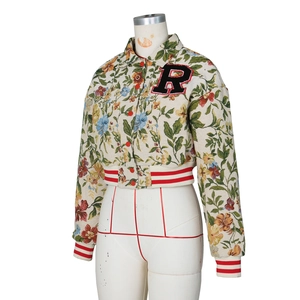 Detail of cropped jacquard baseball jacket with floral pattern and R letter patch