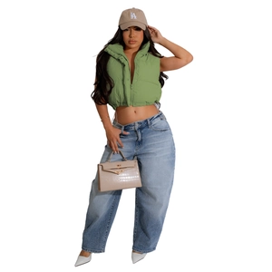 Close-up of grass green padded vest featuring a stand collar and drawstring hem detail