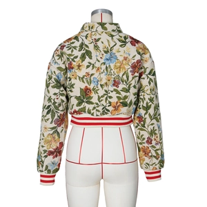 Macro shot of floral jacquard jacket back with striped ribbed hem and cuffs detail