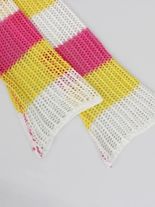 Detail of colorful crochet knit mesh fabric with pink, yellow and white stripe texture