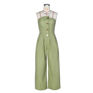 Detail of light green strapless jumpsuit showing asymmetrical lapel and gold buttons