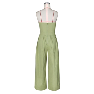 Detail view showing back zipper closure and waist pleats on light olive wide-leg jumpsuit