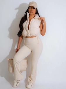 Women's beige stand collar puffer vest with matching flared pants and casual accessories
