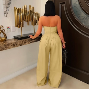 Back view of a yellow tube top jumpsuit with a long hidden zipper and high waist wide legs