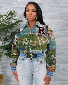 Close-up of vintage tapestry jacket featuring sunflower prints and embroidered R patch