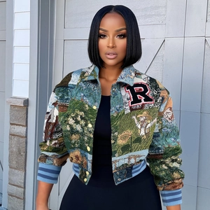 Detailed view of cropped tapestry jacket with colorful scenic print and R letter patch