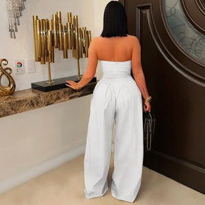 Rear view of the white strapless wide-leg jumpsuit showing the back zipper detail