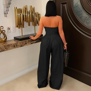 Detailed back view of a black strapless wide-leg jumpsuit with an invisible zipper closure