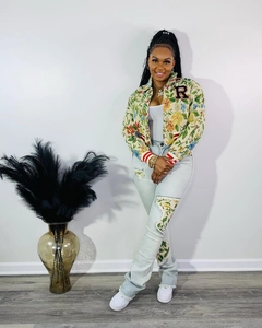 Detail of floral patchwork design on sleeve and denim pants of the 2-piece jacket set