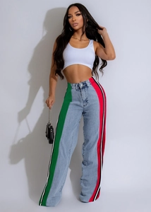 Detail view of high-waisted wide-leg jeans with green and red contrast side stripes