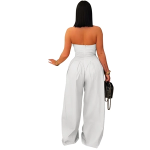 Back view of a white strapless jumpsuit with high waist wide leg cut and zipper detail