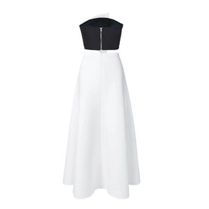 Detail of the black tube top with back zipper and elegant white high-waist A-line skirt