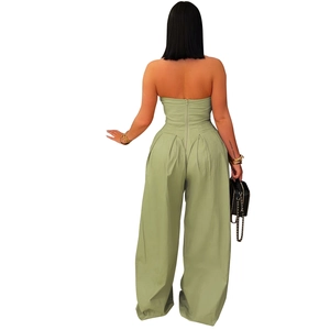 Detail view of sage green tube wide-leg jumpsuit with back invisible zipper and pleated waist