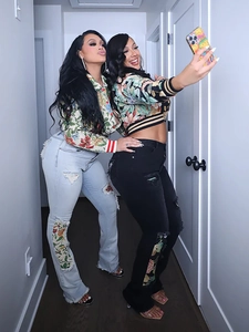 Women's floral jacquard bomber jacket with matching distressed patchwork denim jeans