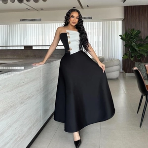 Detail view of two-piece dress set with gold buttons and high-waisted A-line skirt