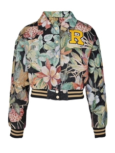 Detail of vintage floral jacquard fabric with embroidered R patch and striped cuffs